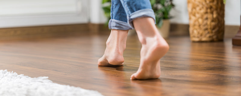 Heat-resistant rug pads for radiant heat floors