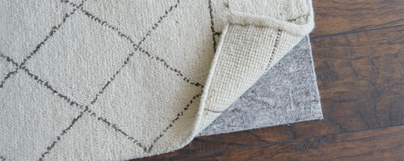 Why wool rugs need pads (and why size matters)
